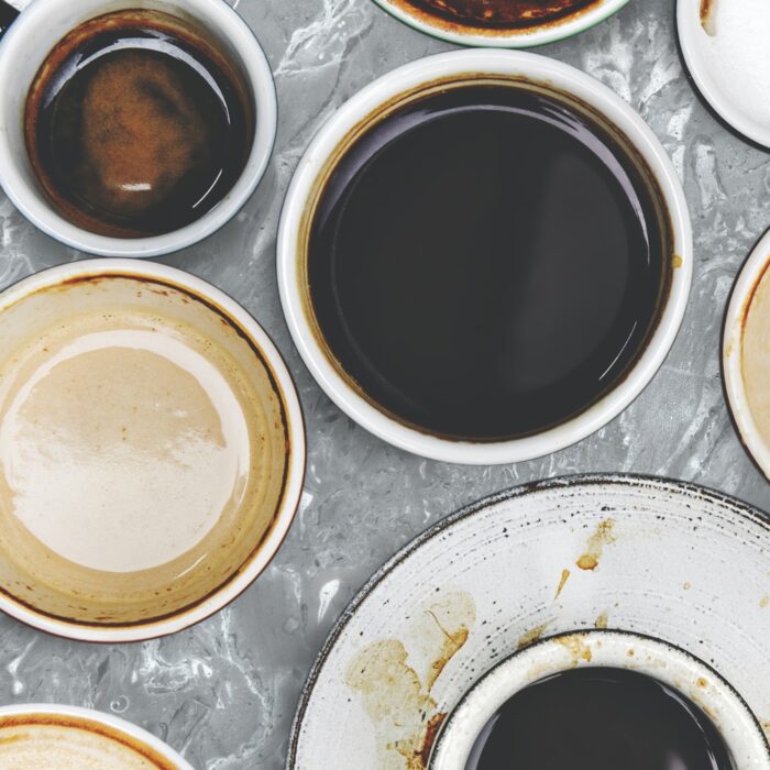 Assorted coffee cups on a marble background