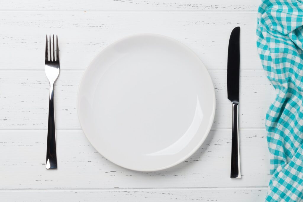 Empty plate with cutlery